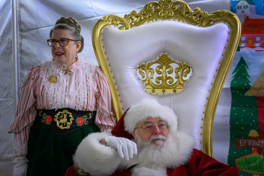 Dave Carrier (above, with his wife Valerie), says he doesn't mind the sore ribs he gets from hugging people during Christmas because he genuinely enjoys lifting people's spirits.