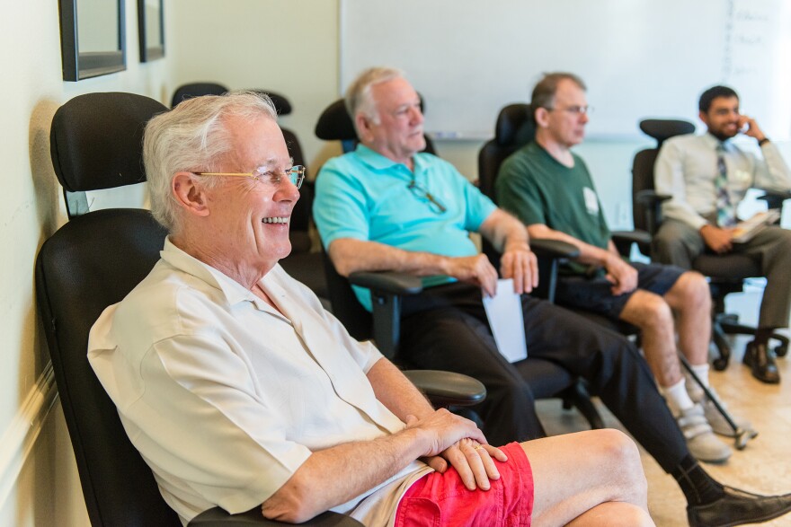 John Evard (left) participated in group therapy during his stay at the rehab center. He was prescribed increasing dosages of opioids to manage his pain, Evard says, but it didn't work, and he was unable to quit the pills on his own. "I was effectively housebound," he says.