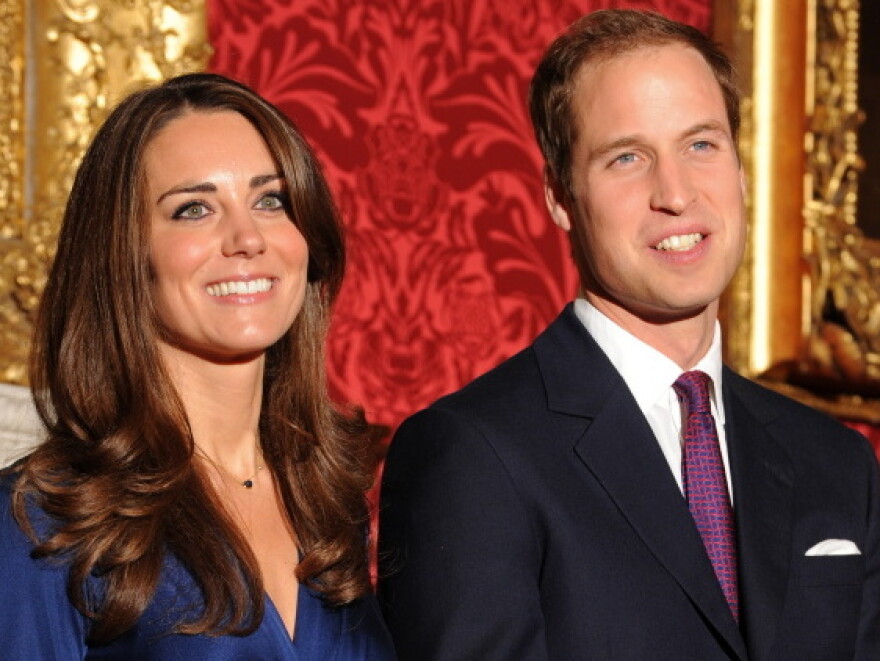 William and Kate posed for photos Tuesday at St. James' Palace to mark their engagement after a courtship lasting nearly eight years.