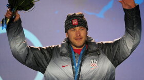 Alpine skier Bode Miller of the United States won a bronze medal in the men's downhill race Monday during the Vancouver Winter Olympics. Miller, who performed poorly at the Torino Games, is approaching these games with a new attitude.