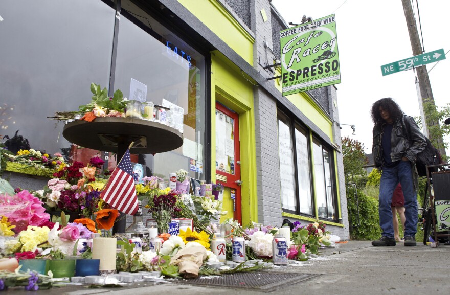 A memorial outside Seattle's Cafe Racer on Thursday, a day after a deadly shooting inside. Just a few days later, musicians gathered outside the coffeehouse for an improvised memorial jam session.