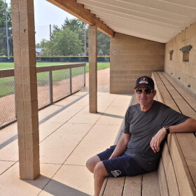 Tony Rouco, manager of the Boulder Collegians baseball team, in the bleachers at Scott Carpenter Park in Boulder, Colorado.