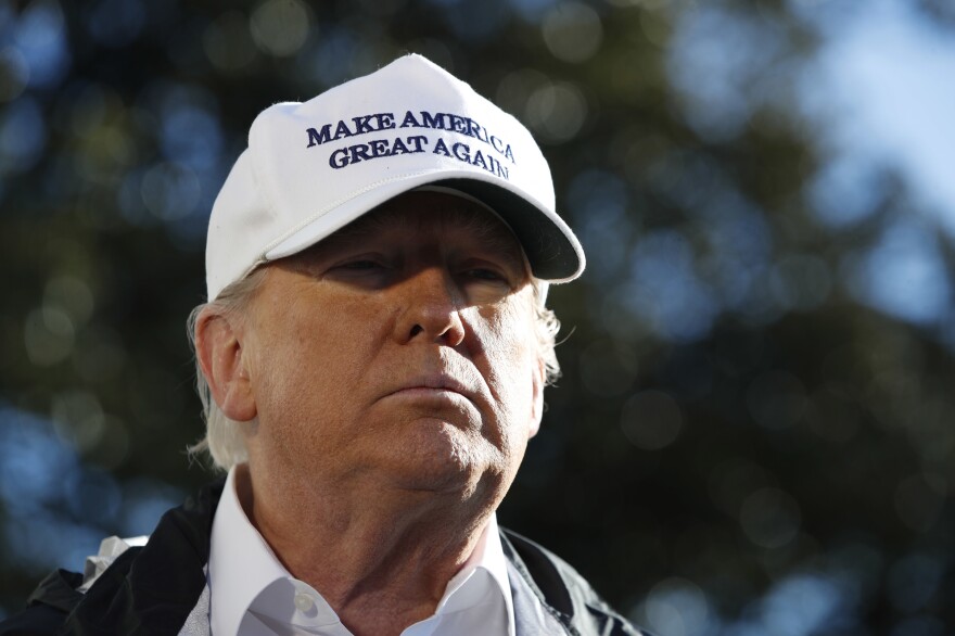 President Trump addresses the media as he leaves the White House on Thursday en route for a trip to the border in Texas.
