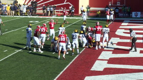 Michael Penix Jr. celebrates a third quarter touchdown after handing it off to running back Stevie Scott III on the goal line.