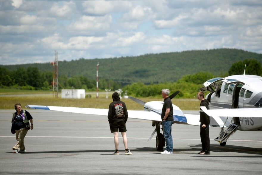 Passengers disembark off a flight from Boston at the Lebanon Municipal Airport on June 16, 2026 in West Lebanon, New Hampshire. (Valley News photo)