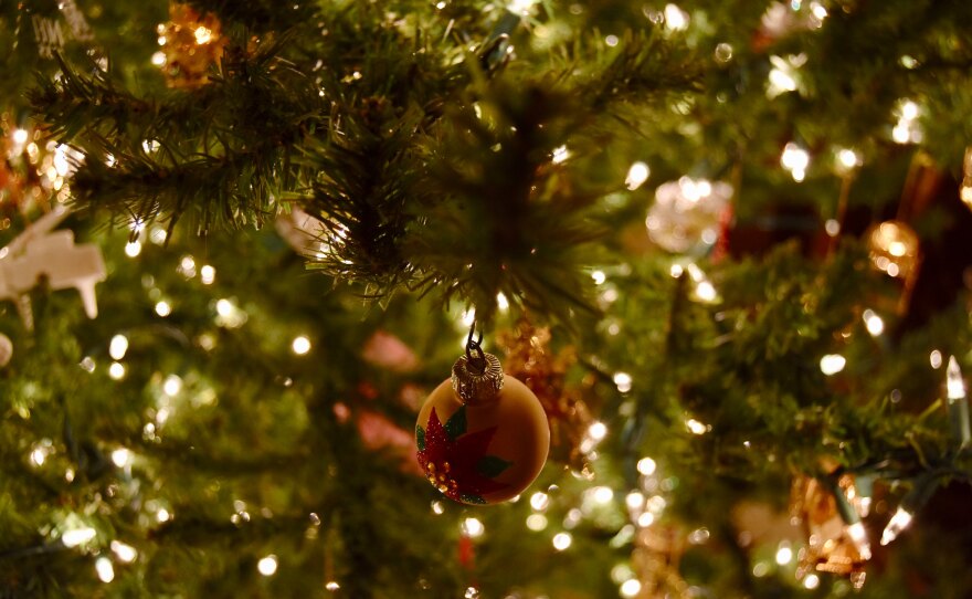 A close up of a decorated and lit Christmas tree.