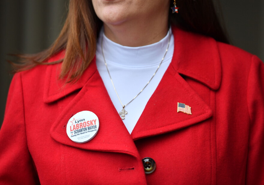 Lynn Labrosky speaks with WVIA News, showing off her campaign pin before heading into West Scranton High School to cast her vote.