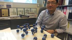 Peter Ye, an electrical engineering professor at Purdue University, with his model of black phosphorus