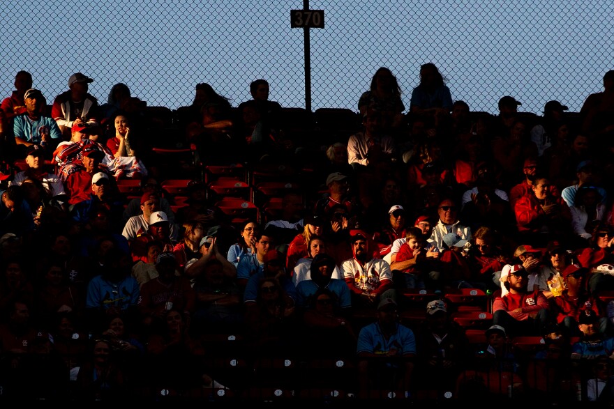 The sun begins to set on fans watching the St. Louis Cardinals watch the Toronto Blue Jays on Thursday, March 30, 2023, during Opening Day at Busch Stadium.