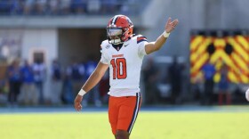 Quarterback Rickie Collins (White, 10) gives instructions to his offense in SU’s loss to SMU.
