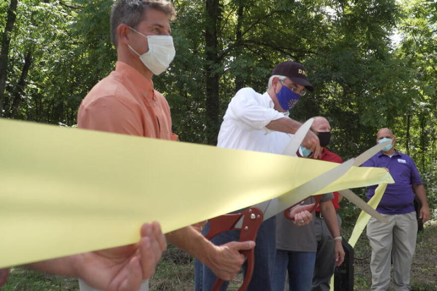 Gov. Eric Holcomb at a ribbon cutting for Ravinia State Forest.