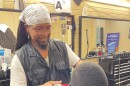 Charles Smith has been a barber for more than 30 years, but recently started his own business. His client Raymond Nickerson (right) just started a janitorial service.