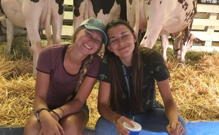 Emma and her sister with their cattle