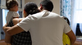 Olman embraces his family, who he was reunited with after spending nine months in an ICE detention center.