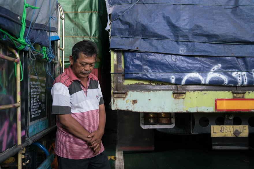 Rahmat, 53, is transporting a truck full of chips to Lombok. He travels by ferry about once a month from East Java, where he lives.