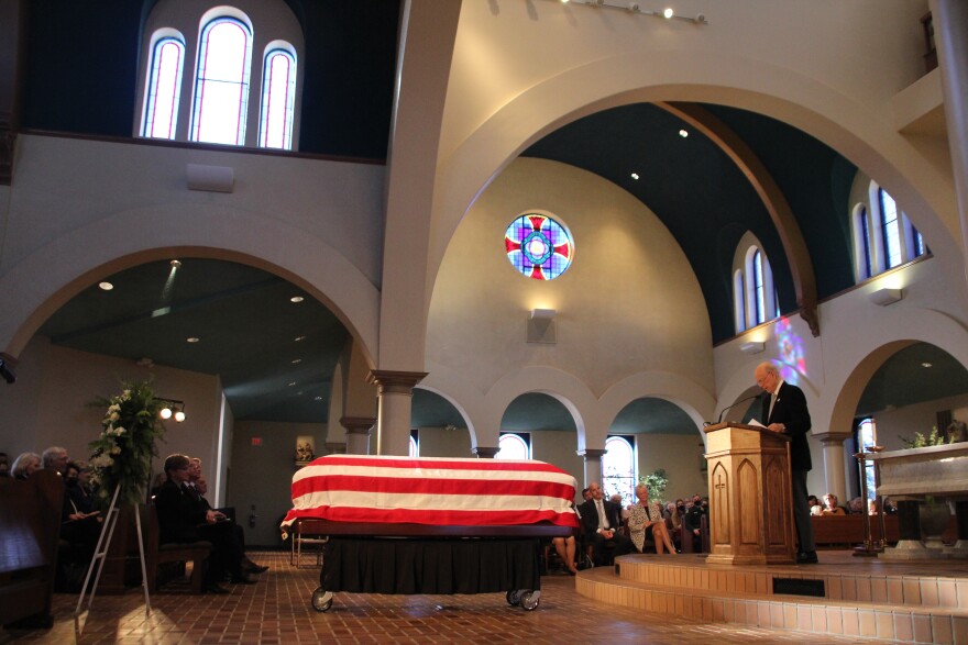 Former U.S. Senator Pat Roberts delivers a message from the podium at Dole's memorial in Russell.