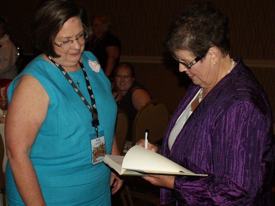 Macomber's readers feel like they have a personal relationship with the author, who happily poses for photos and signs books for endless lines of fans.