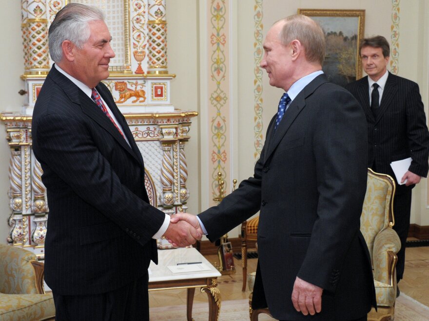 Vladimir Putin shakes hands with Rex Tillerson, chairman and chief executive officer of ExxonMobil Corp., at a meeting in April 2012, when Exxon teamed up with Russian oil giant Rosneft.