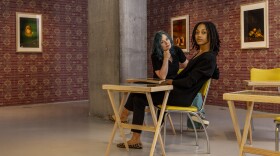 Glenna Jennings and Jalisa Robinson sit within their exhibition at Cincinnati Contemporary Art Center 
