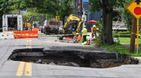Crews are seen working near a sinkhole that opened up under Horton Street near Roosevelt Terrace in Wilkes-Barre on Monday, July 14. It was the second road collapse on Horton Street in less than a month. An earlier sinkhole opened up about a half block away on June 25.