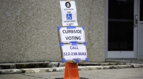 Curbside voting outside the Northwest Recreation Center voting location in Austin.