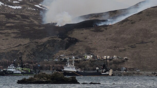 The department responded to the grass fire on the hillside above Westward Seafoods on Captains Bay Road midday Monday.