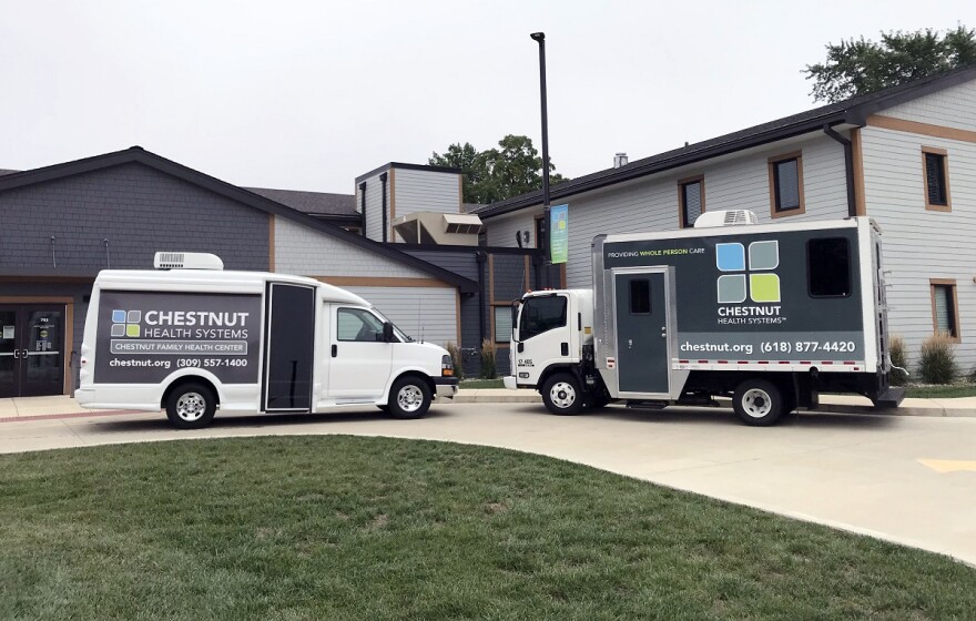 Shuttle bus and van parked