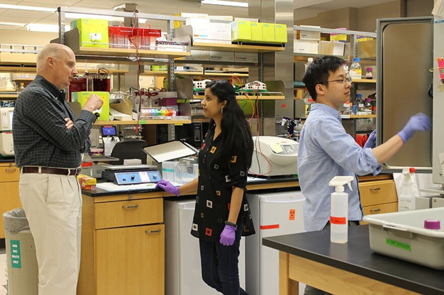Virologist John Patton and his students at his Indiana University lab.