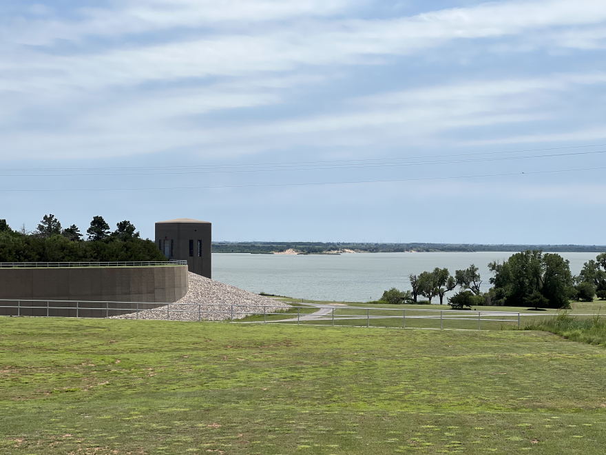  Lake Fort Supply sits beyond a concrete structure and a walking path