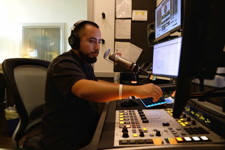 Jose Sandoval at the board in Studio B at Blue Ridge Public Radio, where he hosted All Things Considered for nearly three years.