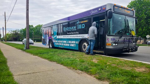 Riders board a Saginaw Transit Authority Regional Services bus at a stop in Saginaw, Michigan, on Friday, May 15, 2026.