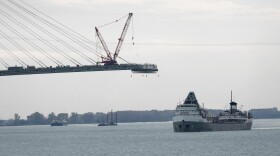 FILE - The Saginaw passes construction on the Gordie Howe International Bridge connecting on the Detroit River connecting Windsor, Ontario and Detroit, Oct. 25, 2023.