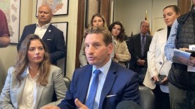 Dean Phillips speaks with reporters after filing for New Hampshire primary