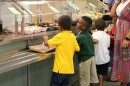  Students stand in the lunch line at an elementary school in Hillsborough County.
