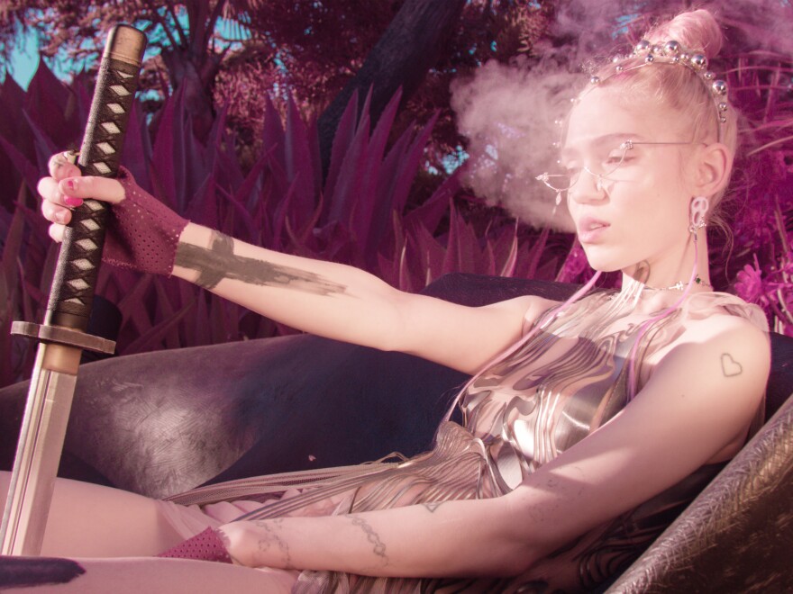 Grimes' fifth album, <em>Miss Anthropocene</em>, pushes the pleasure buttons of mainstream pop while also appearing to critique it.