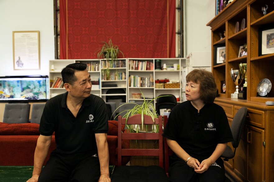 Pei and Zhang chat during a class break. The couple met and married in the 1980s.