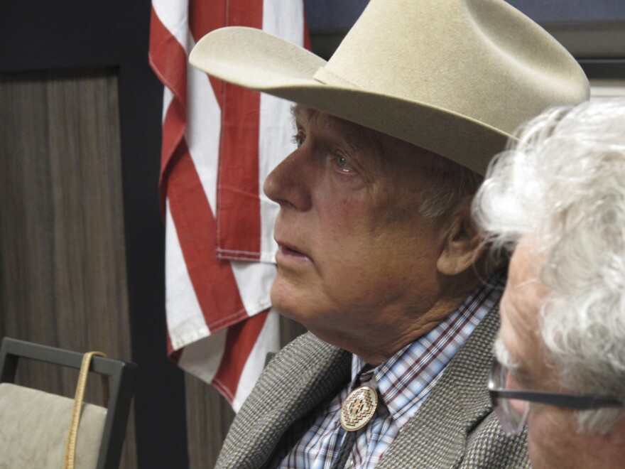 Cliven Bundy listens to other speakers before giving the keynote address to the state convention of the Independent American Party of Nevada, in February 2018.