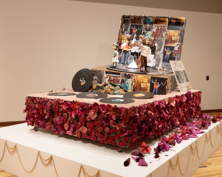 Mario Ybarra’s piece "Music My Mom Played While Cleaning the House" is on display at the Albuquerque Museum.