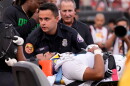 Oregon quarterback Dante Moore, bottom, is loaded into an ambulance following a hard tackle by Southern California linebacker Desman Stephens II during the first half of an NCAA college football game, Saturday, Sept. 26, 2026, in Los Angeles.