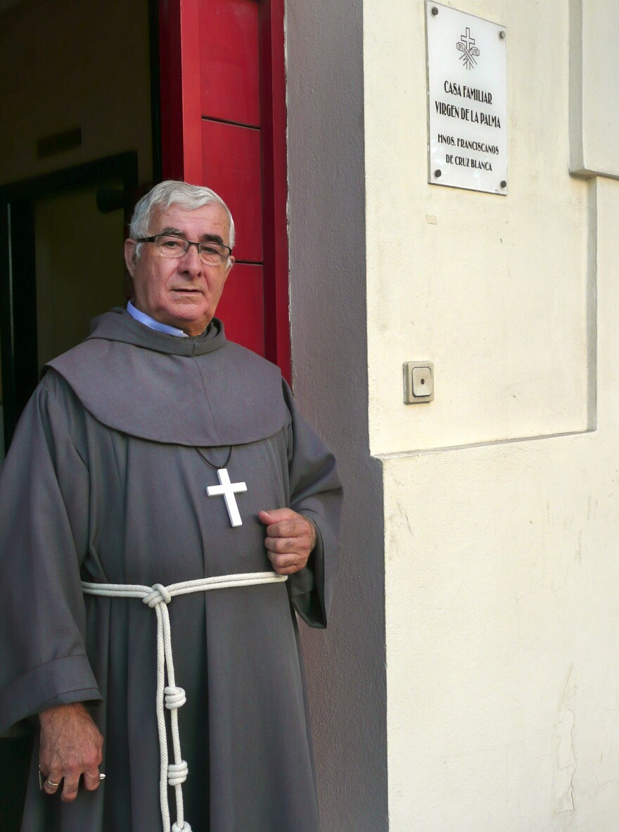 Isidoro Macías Martín, aka "Padre Patera," stands in front of his monastery office across the street from the port of Algeciras, in southern Spain. Martín is a Franciscan brother who for 40 years has been the first point of contact in Spain for thousands of Africans arriving illegally by boat.