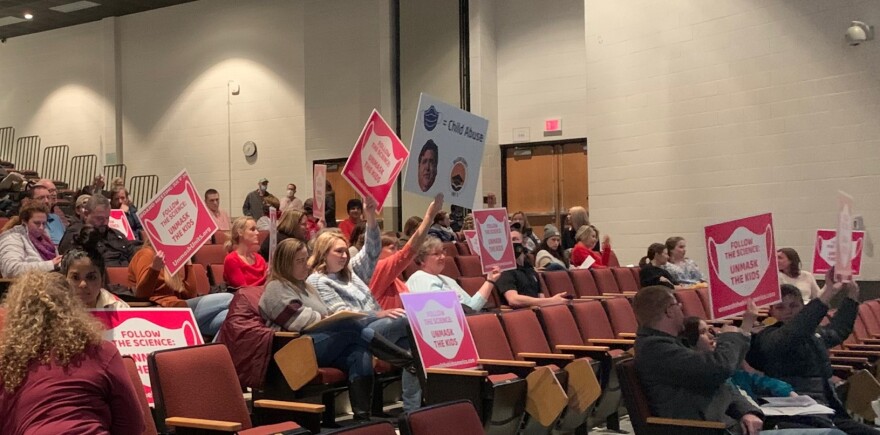 A crowd waits for the Unit 5 school board meeting to begin Wednesday, Feb. 9, 2022, in the Normal West Community High School auditorium.