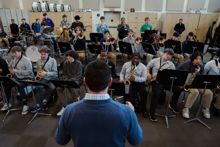 Christian Brothers College High School Band Director Tom Broussard directs his band in rehearsing a jazzy rendition of Leroy Anderson's "Sleigh Ride" on Wednesday.
