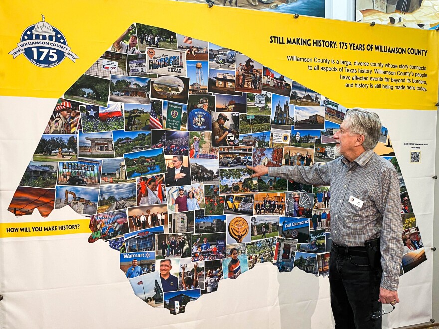 Ron Bennett, a volunteer at the Williamson Museum in Georgetown, examines the museum's new exhibit, titled "Still Making History: 175 Years of Williamson County."