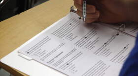 A student looks at questions during a college test preparation class. (Alex Brandon/AP)