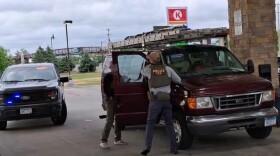 Men who appear to be Immigration and Customs Enforcement agents are parked outside Circle K gas station on Paul Bunyan Drive on Friday, June 12, 2026.