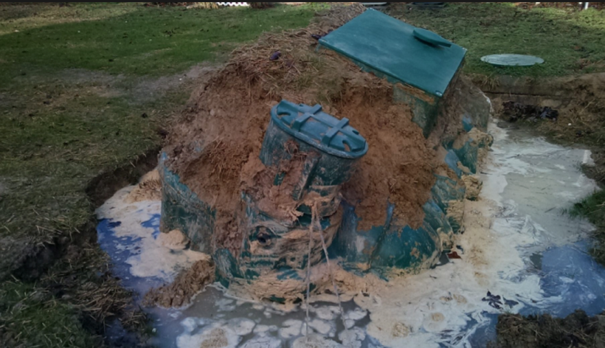 A plastic tank floating out of the ground when pumped under flooded/shallow water conditions.