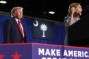 President Donald Trump listens as Sen. Darline Graham, R-S.C., speaks during her campaign rally at the Myrtle Beach Convention Center in Myrtle Beach, S.C., Friday, Aug. 21, 2026.