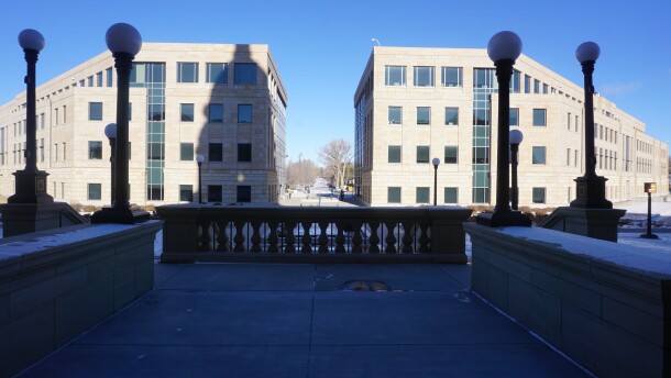 The office buildings behind Capitol building in Cheyenne, snow on the ground, clear skies