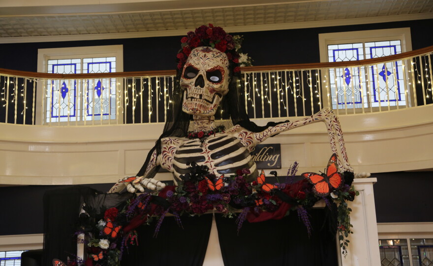 La Catrina overlooking the dance floor for the Día de Muertos Masquerade Ball, painted by local artist Jerry Foote.