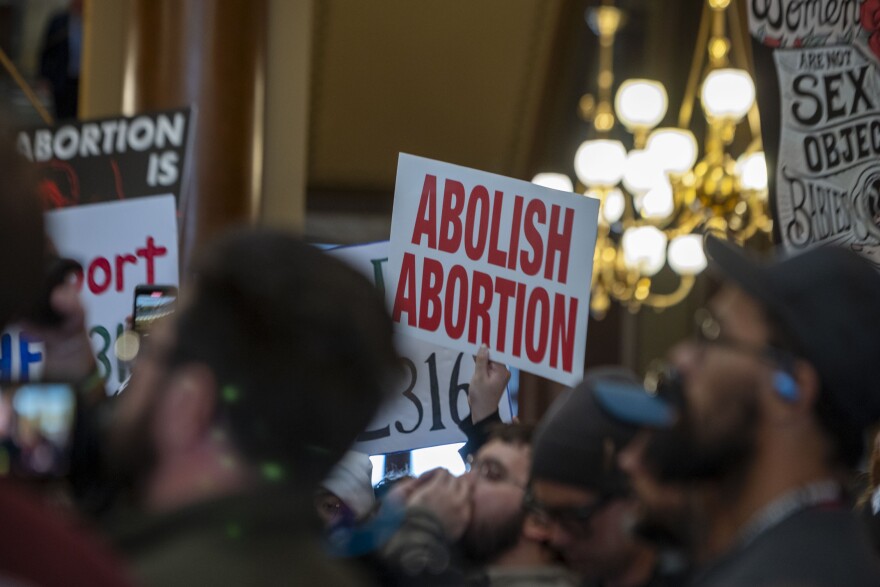 A group of anti-abortion rights protester called on lawmakers to put restrictions on abortion pills sent by mail at the Iowa Capitol Feb. 9, 2026.